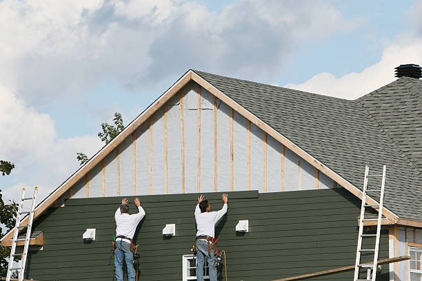 Professional Storm Damage Siding Repair technician working in Orviston, PA